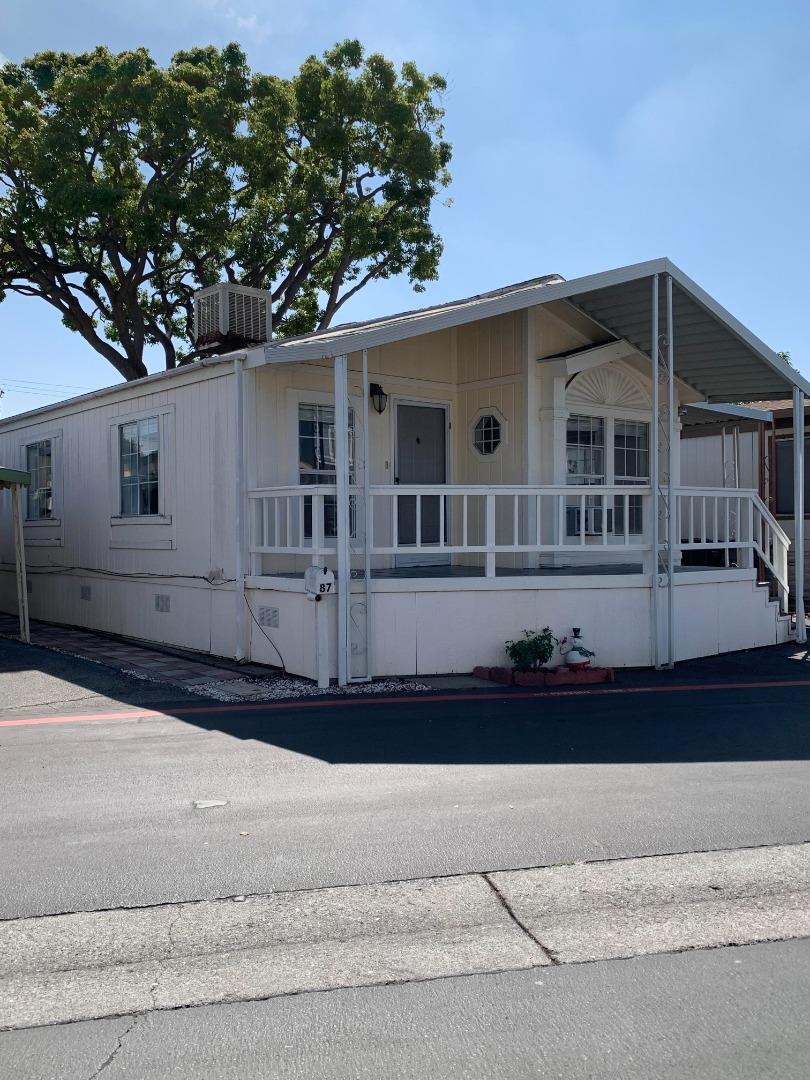 1201 Sycamore Terrace, Unit 87 Sunnyvale, CA 94086 - Photo 23 of 26 a front view of a house with a yard