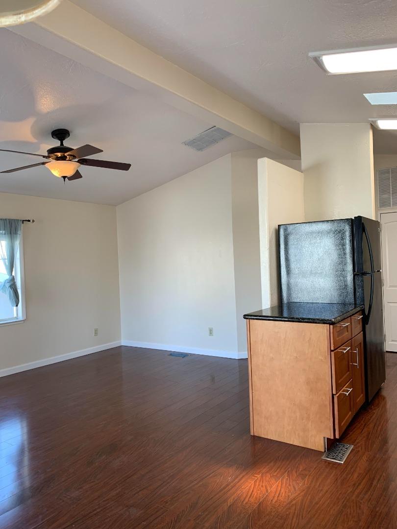 1201 Sycamore Terrace, Unit 87 Sunnyvale, CA 94086 - Photo 9 of 26 a view of an empty room with wooden floor and a window