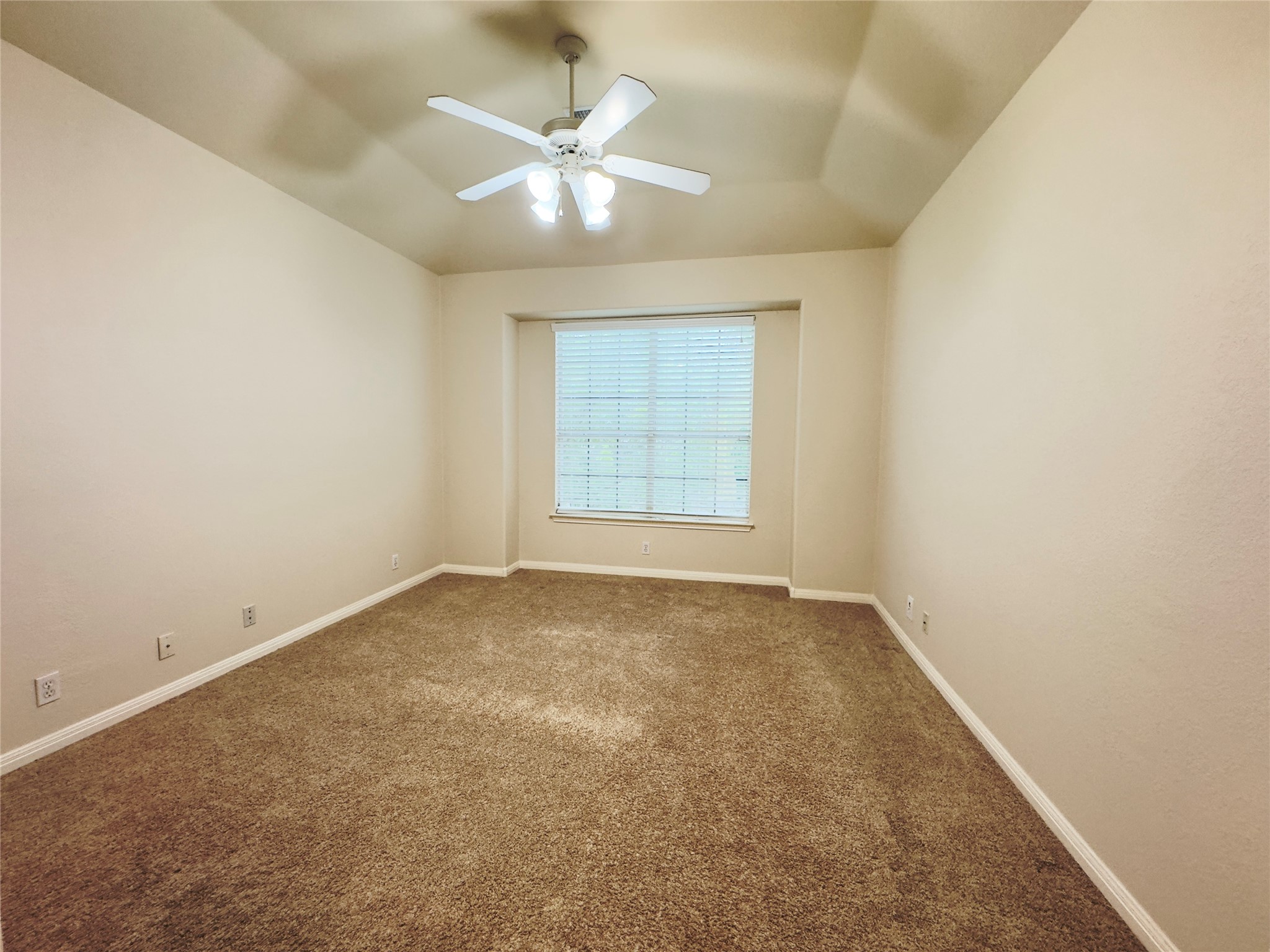 4508 Duval Road, Unit 6602 Austin, TX 78727 - Photo 14 of 23 an empty room with a chandelier fan and windows