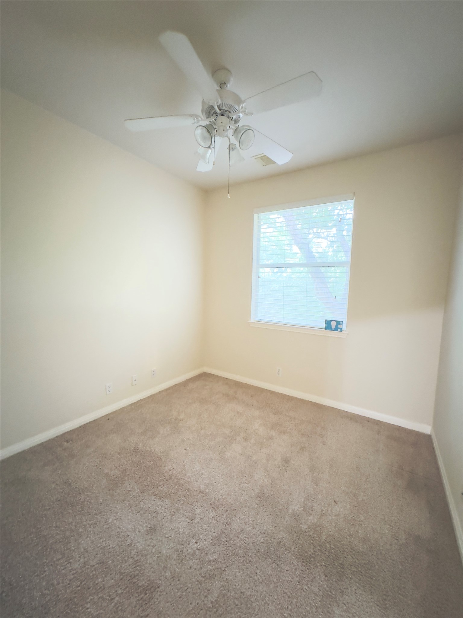 4508 Duval Road, Unit 6602 Austin, TX 78727 - Photo 17 of 23 an empty room with a window and a chandelier fan