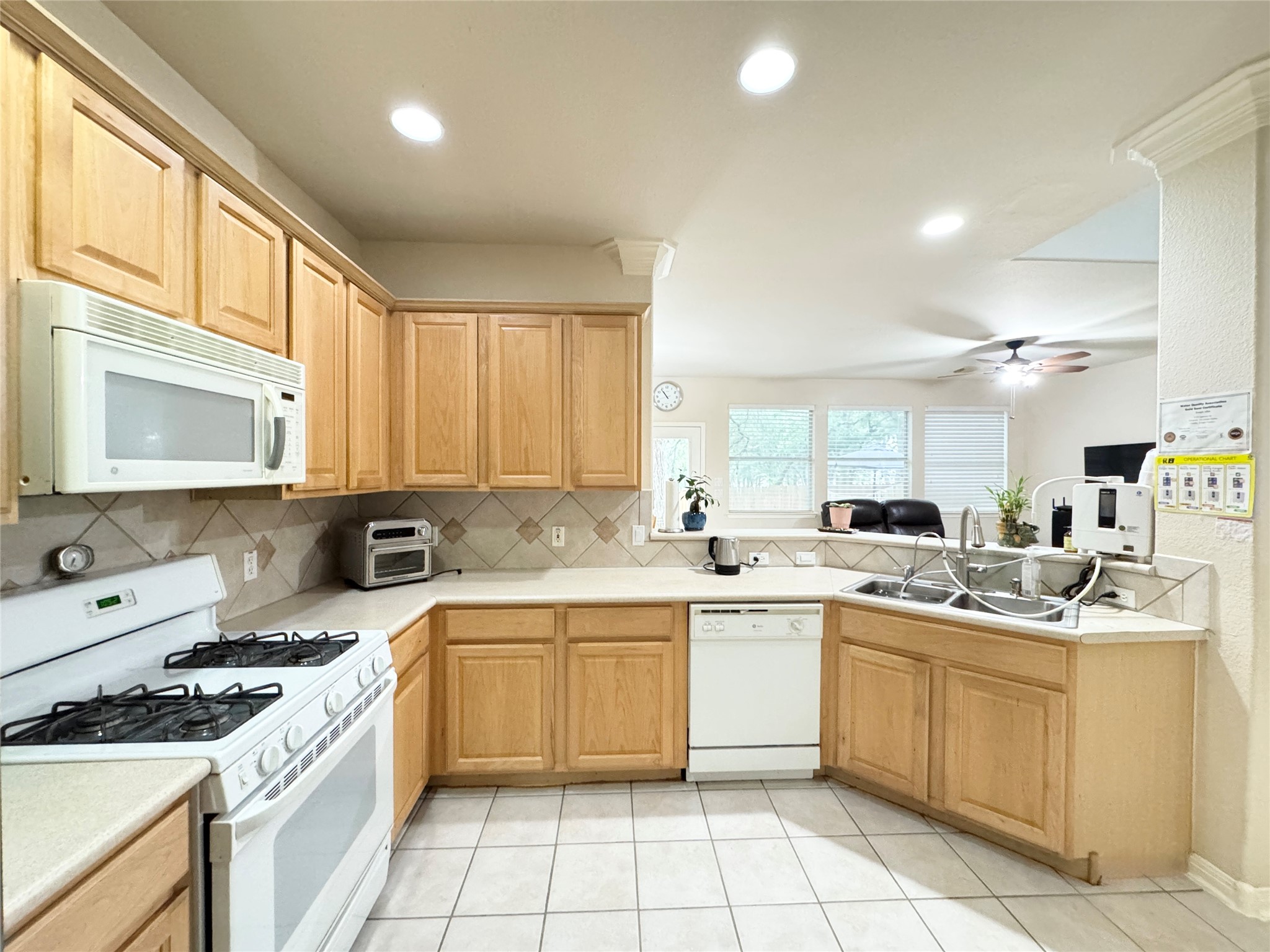 4508 Duval Road, Unit 6602 Austin, TX 78727 - Photo 8 of 23 a kitchen with a sink stove top oven and cabinets