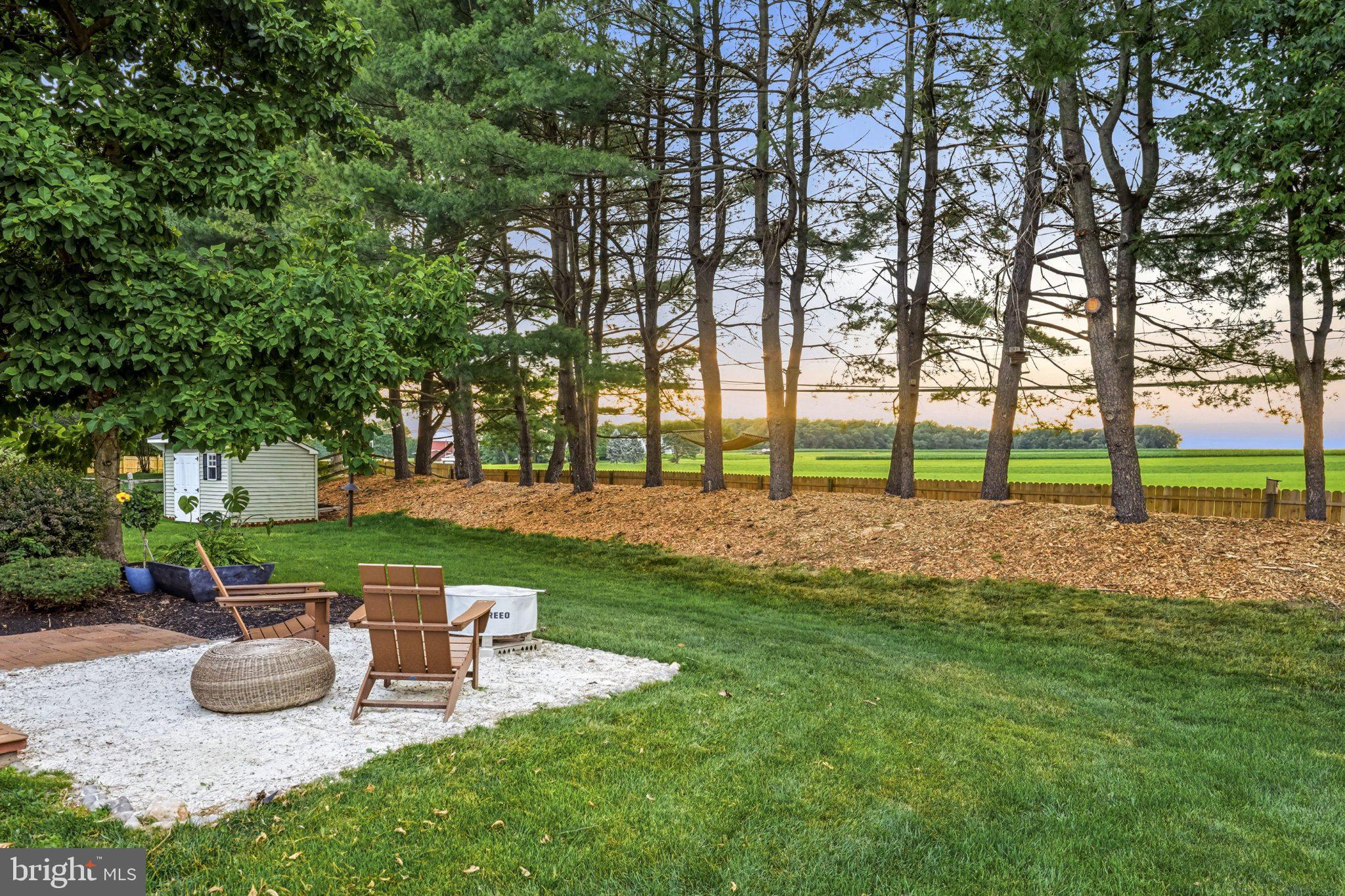 2134 West Wellington Road Newtown, PA 18940 - Photo 36 of 42 Serene backyard retreat at sunset.