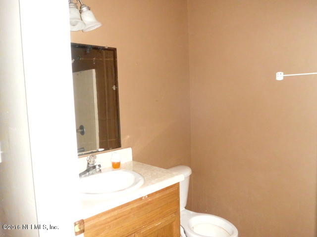 1800 Bennett Road St. Augustine, FL 32092 - Photo 14 of 24 a bathroom with a sink and a mirror