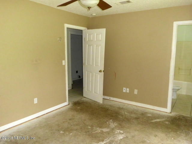 1800 Bennett Road St. Augustine, FL 32092 - Photo 17 of 24 an empty room with a ceiling fan and closet