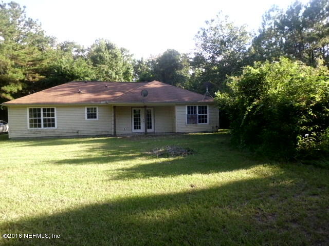 1800 Bennett Road St. Augustine, FL 32092 - Photo 22 of 24 a house with swimming pool in front of it
