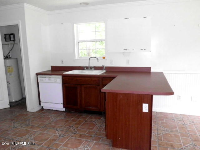 1800 Bennett Road St. Augustine, FL 32092 - Photo 6 of 24 a kitchen with a sink and cabinets
