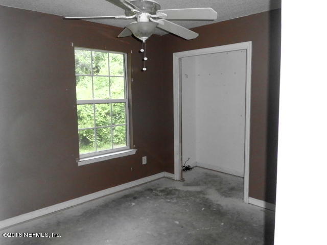 1800 Bennett Road St. Augustine, FL 32092 - Photo 10 of 24 an empty room with a window and a fan