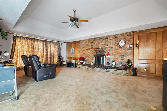 a kitchen with counter top space and wooden floor