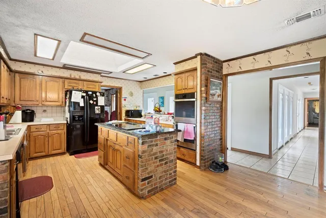 a view of a room with furniture and chandelier