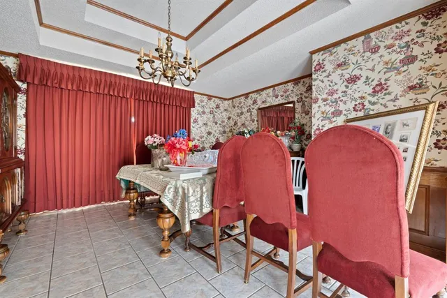 a bedroom with furniture and a flat screen tv