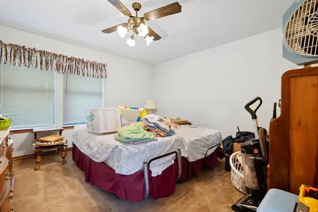 a view of a livingroom with furniture and a window
