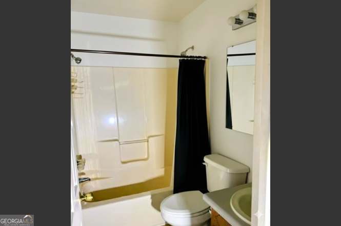 2304 Cummings Road Fort Valley, GA 31030 - Photo 12 of 20 a bathroom with a shower and a toilet