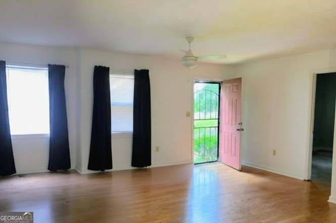 2304 Cummings Road Fort Valley, GA 31030 - Photo 5 of 20 an empty room with closet and windows