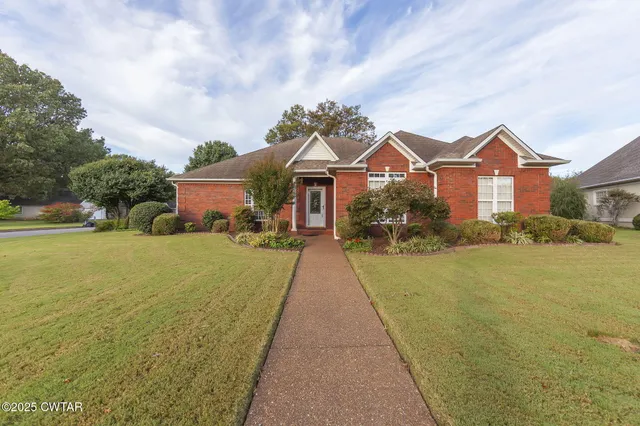 a house with garden in front of it