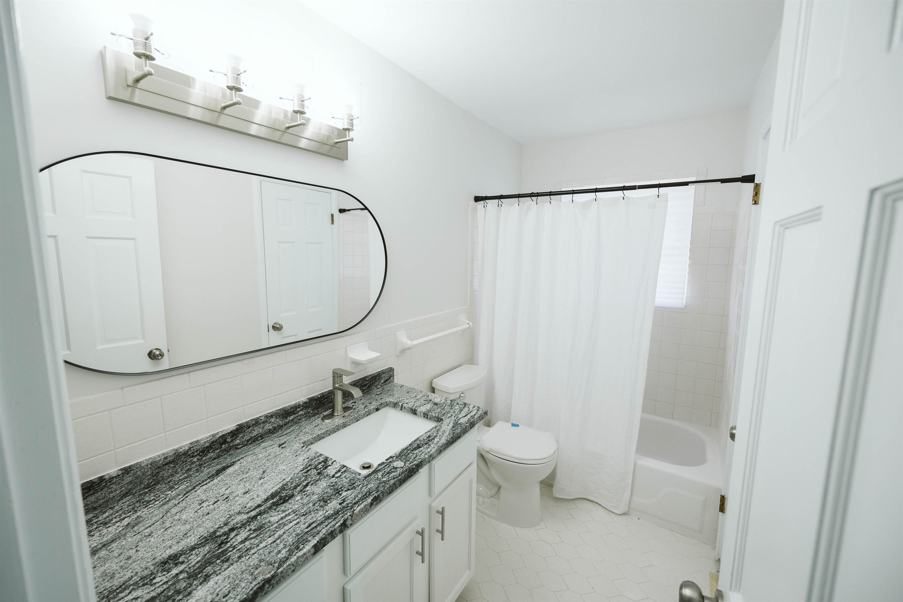 360 Burley Road Collierville, TN 38017 - Photo 6 of 21 a bathroom with a granite countertop sink and a mirror
