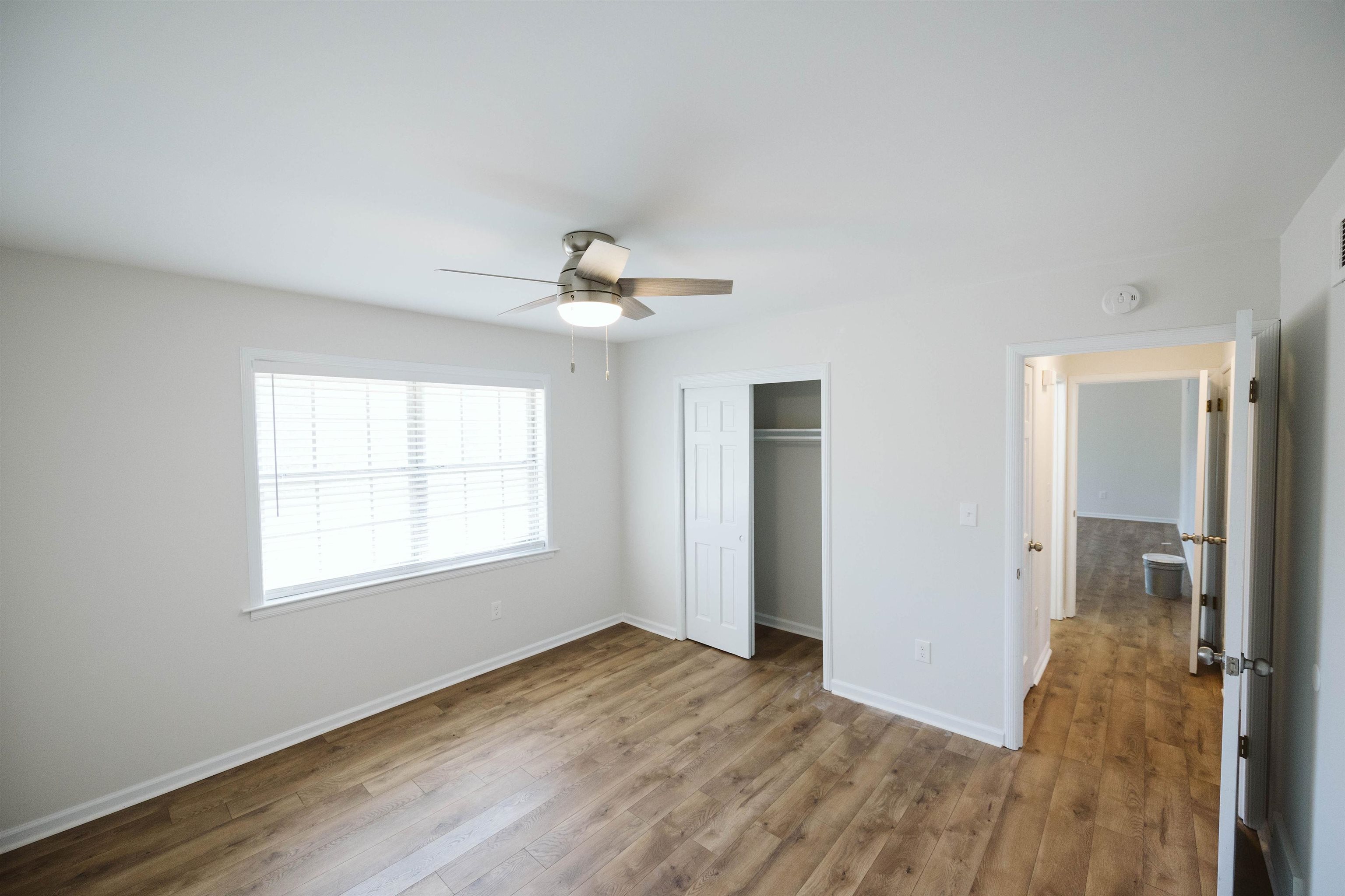 360 Burley Road Collierville, TN 38017 - Photo 8 of 21 a view of an empty room with wooden floor and a window