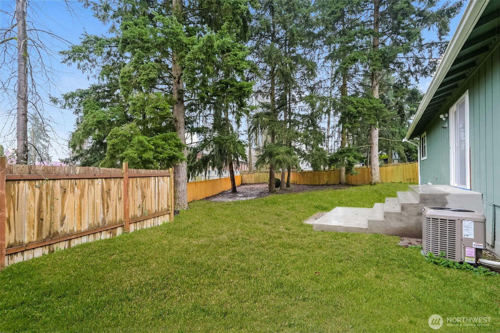 2611 Southwest 333rd Place Federal Way, WA 98023 - Photo 11 of 16 a view of a backyard with wooden fence