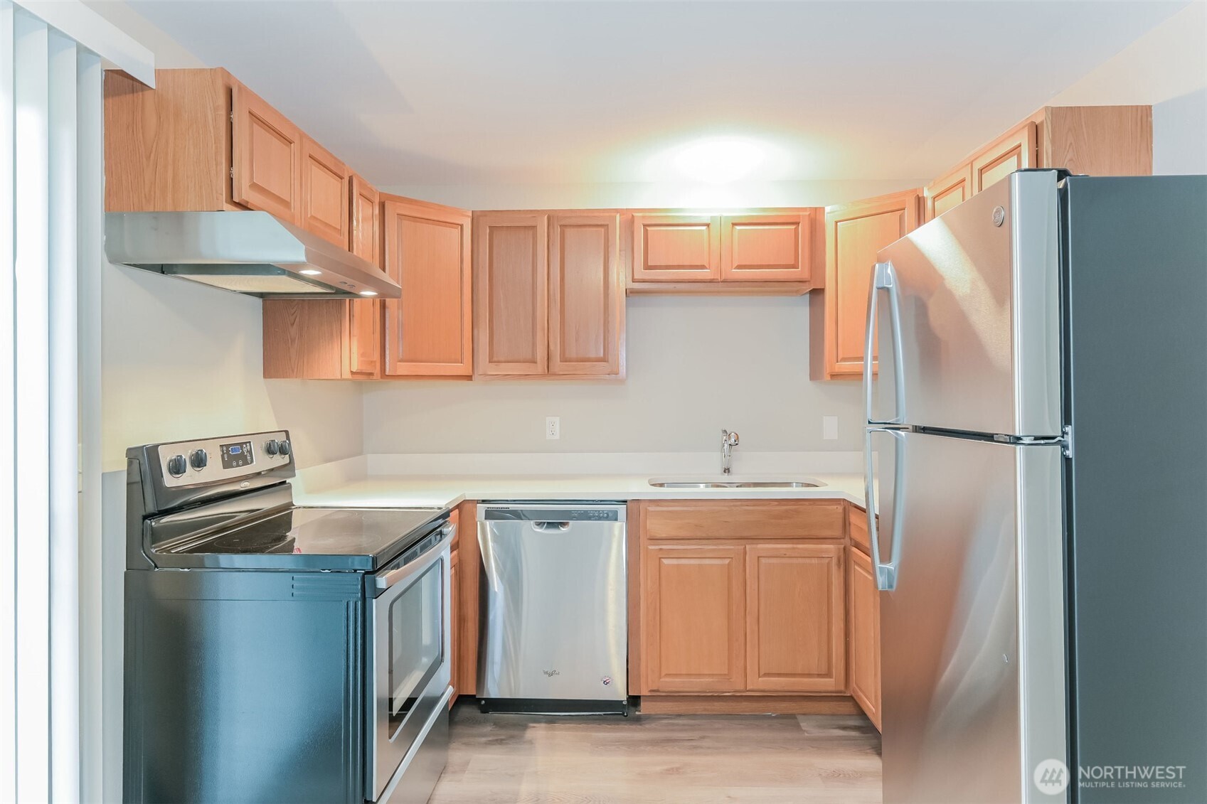 2611 Southwest 333rd Place Federal Way, WA 98023 - Photo 15 of 16 a kitchen with stainless steel appliances a refrigerator sink and cabinets