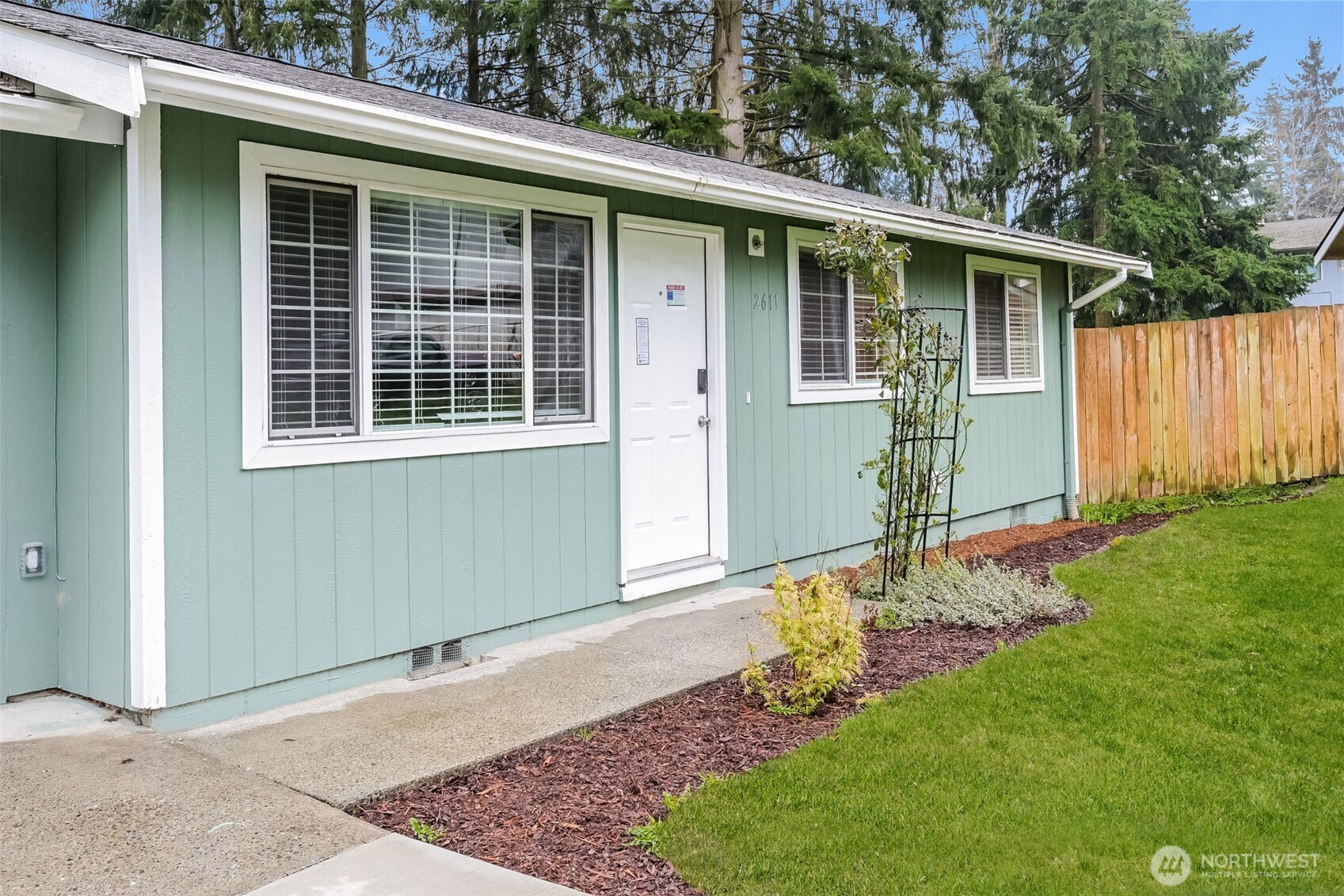2611 Southwest 333rd Place Federal Way, WA 98023 - Photo 2 of 16 a front view of a house with garden