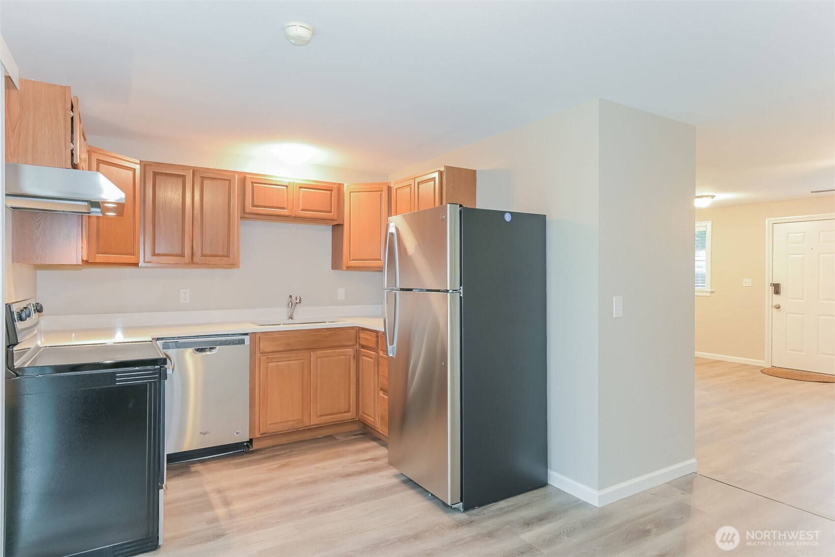2611 Southwest 333rd Place Federal Way, WA 98023 - Photo 6 of 16 a kitchen with stainless steel appliances granite countertop a refrigerator and a sink