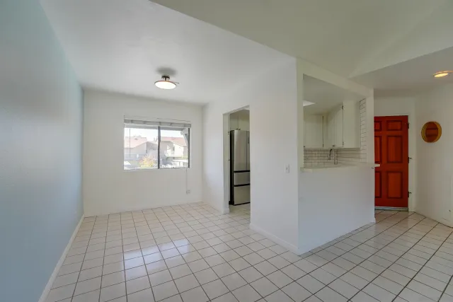 a view of an empty room and window
