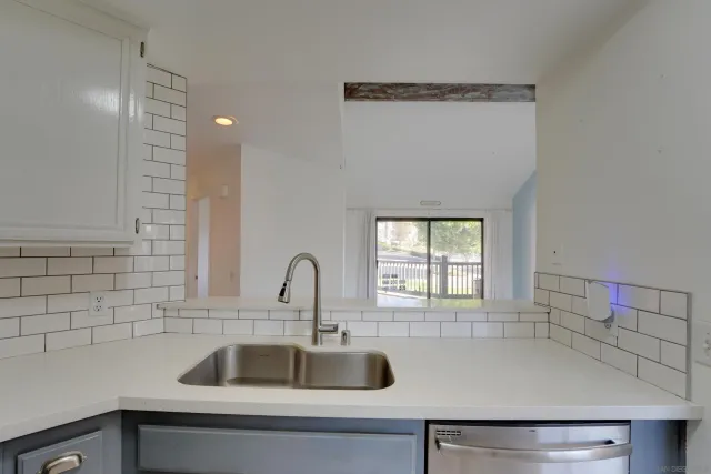 a kitchen with a sink and a window