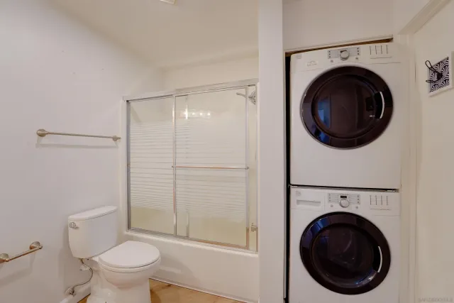 a view of a bathroom with a washer and dryer