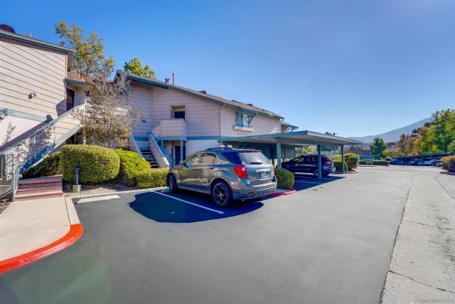a view of street with parked cars