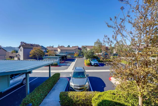 a view of a balcony with chairs