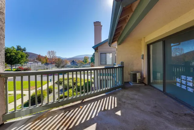 a view of balcony with furniture