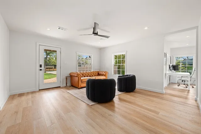 a living room with furniture and a window