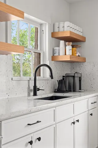 a kitchen with a sink and a window