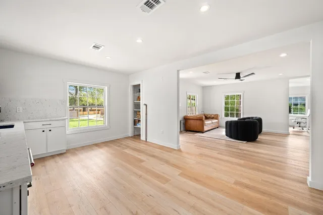 a living room with furniture window and wooden floor