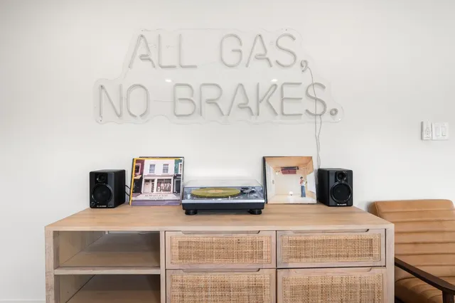 a bedroom with a bed and a table