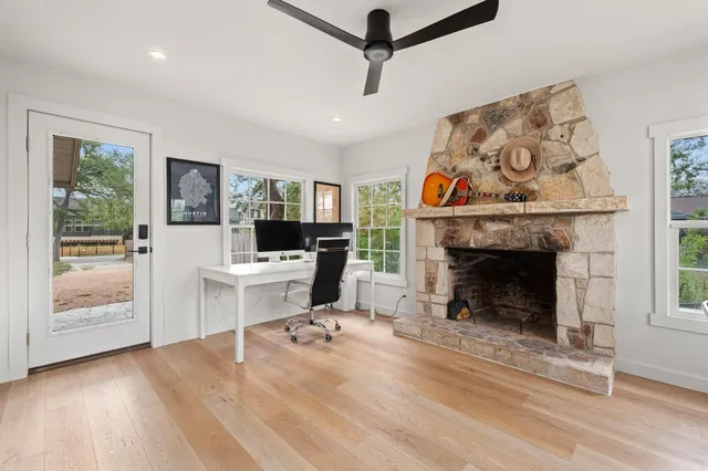 a living room with furniture and a fireplace