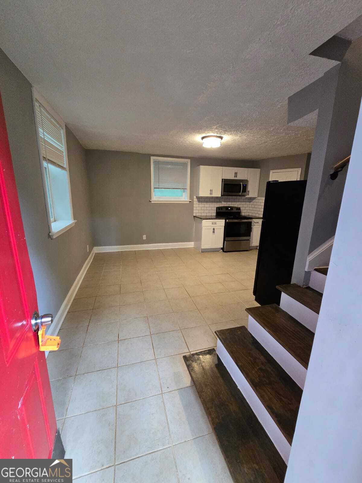 2963 Redwine Road, Unit REAR East Point, GA 30344 - Photo 2 of 9 a view of kitchen with furniture and rug