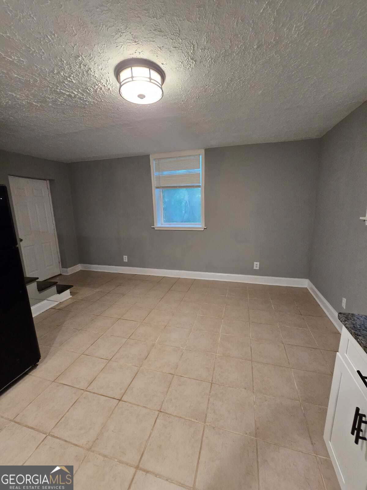 2963 Redwine Road, Unit REAR East Point, GA 30344 - Photo 4 of 9 en empty room with windows