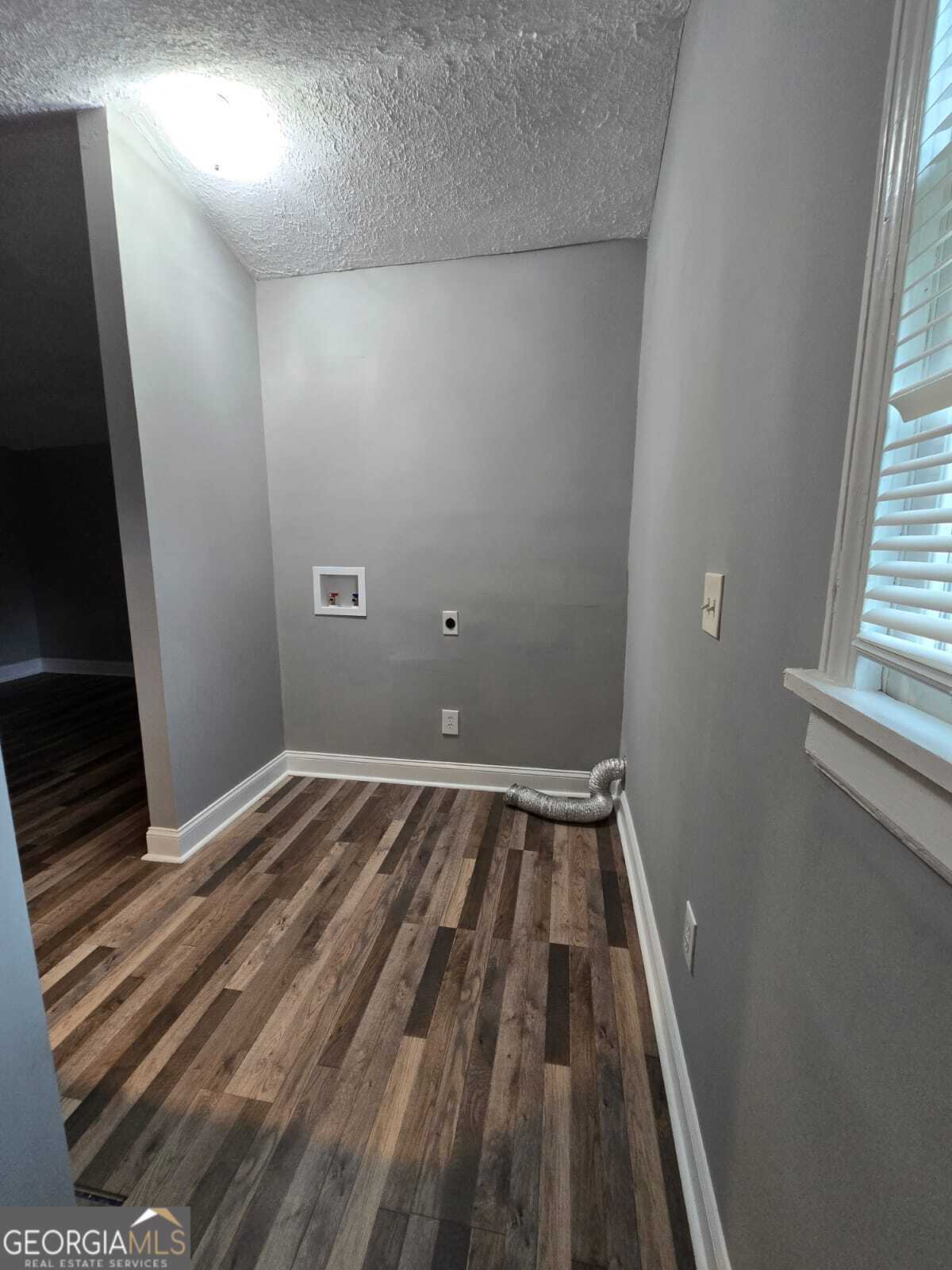 2963 Redwine Road, Unit REAR East Point, GA 30344 - Photo 6 of 9 a view of a room with wooden floor and window