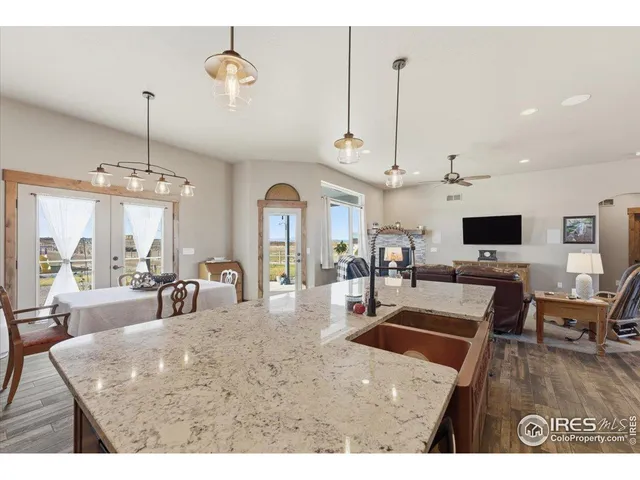 a living room with lots of furniture and a flat screen tv