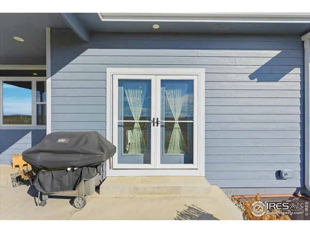 a room with gym equipment and a large window