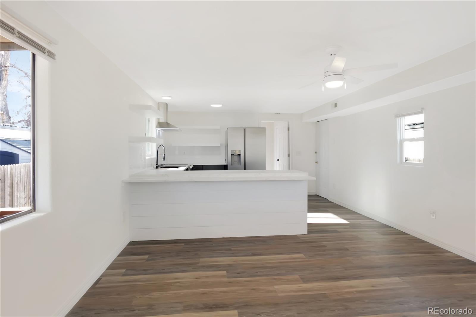 8533 Cook Court Denver, CO 80229 - Photo 12 of 15 a view of kitchen with wooden floor