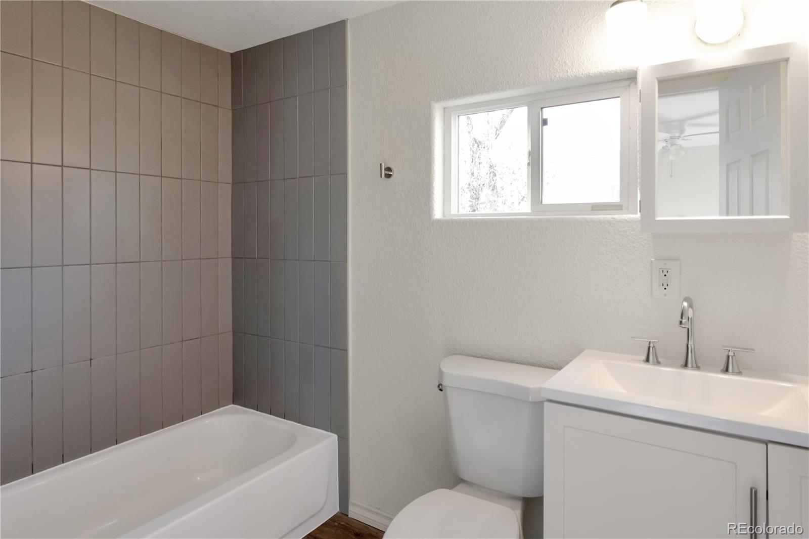 8533 Cook Court Denver, CO 80229 - Photo 14 of 15 a bathroom with a sink and a toilet