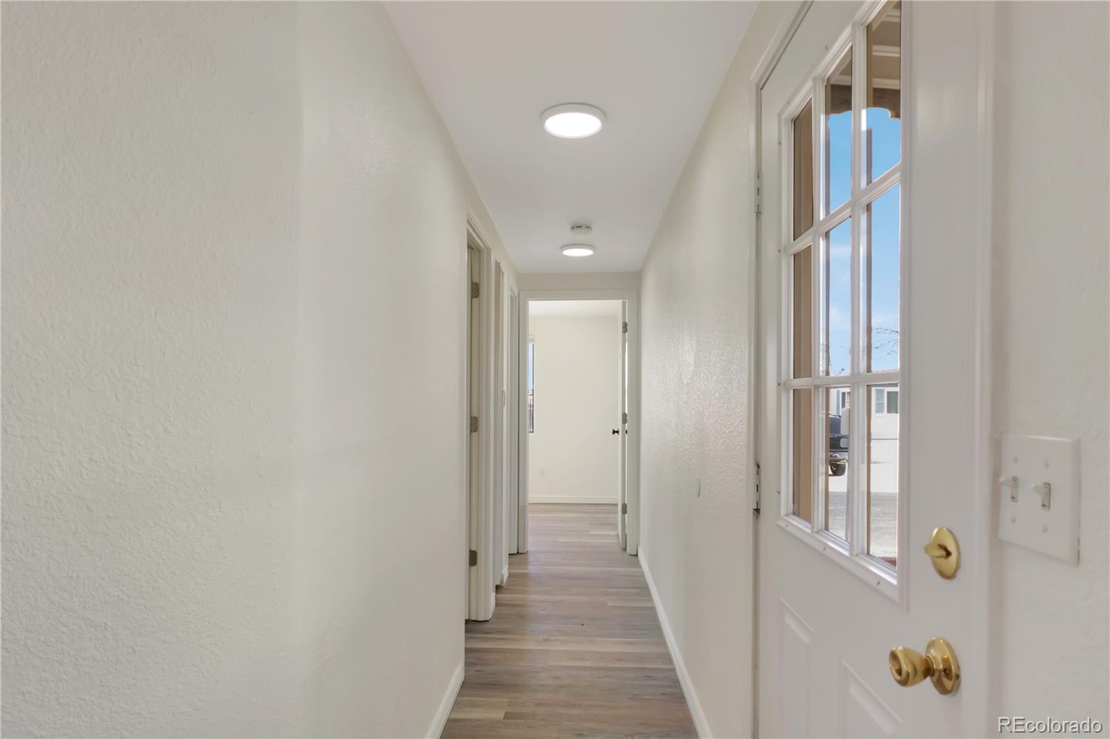 8533 Cook Court Denver, CO 80229 - Photo 6 of 15 a view of a hallway with a elevator