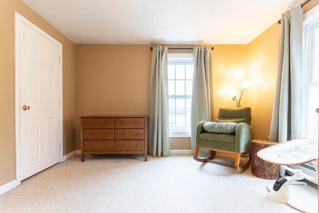 a view of room with furniture and a window