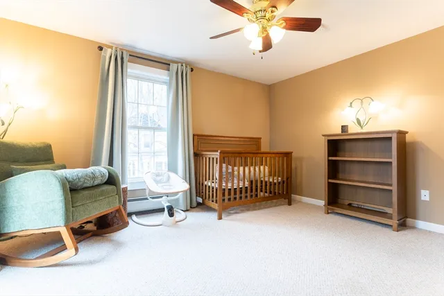 a view of room with a ceiling fan