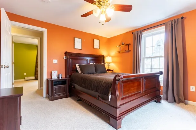 a bedroom with a bed and window