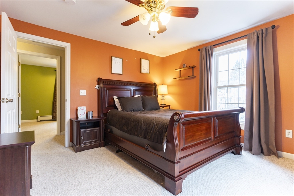 68 D Street Athol, MA 01331 - Photo 19 of 35 a bedroom with a bed and a chandelier