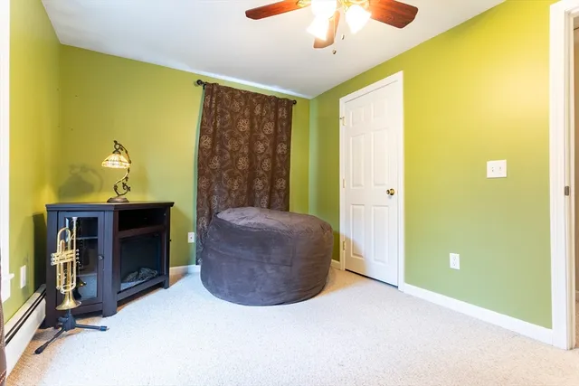 a view of a room with a window and a potted plant