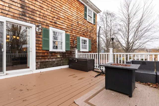 a view of a house with wooden deck