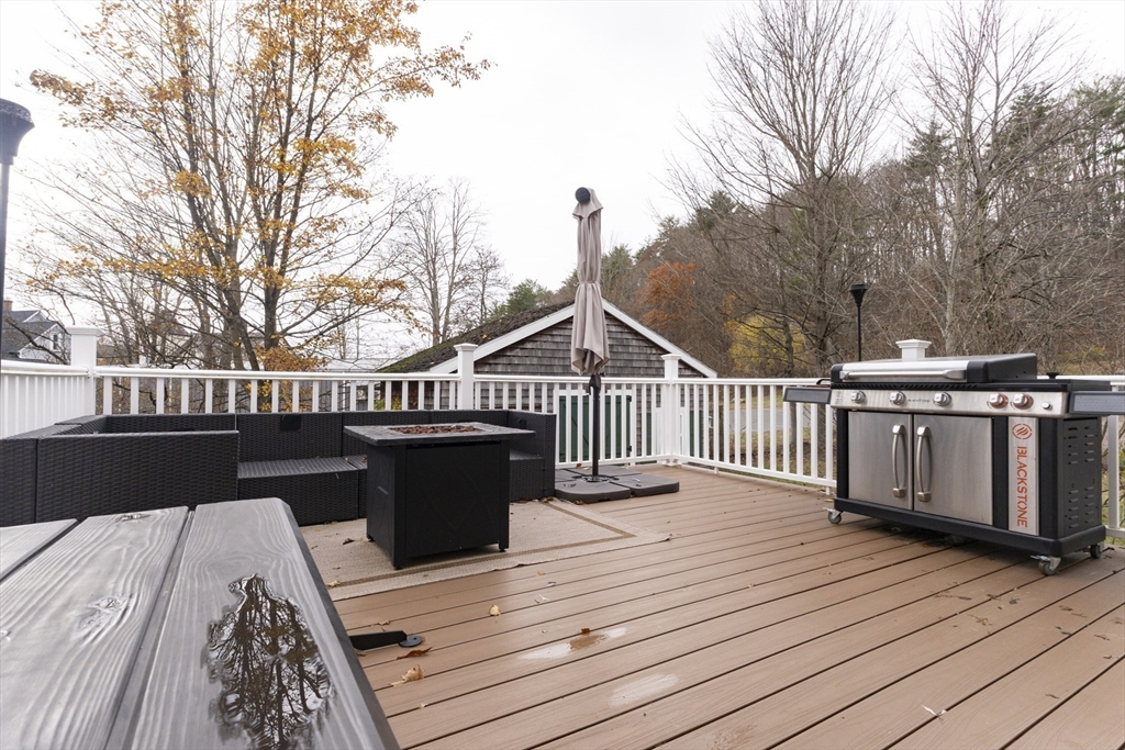 68 D Street Athol, MA 01331 - Photo 28 of 35 a view of a deck with wooden floor and fence with a bench